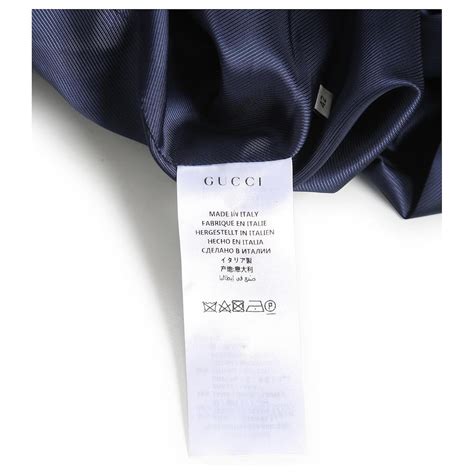 veste gucci bleu et rouge|Gucci Tiger veste à carreaux matelassée en bleu et rouge.